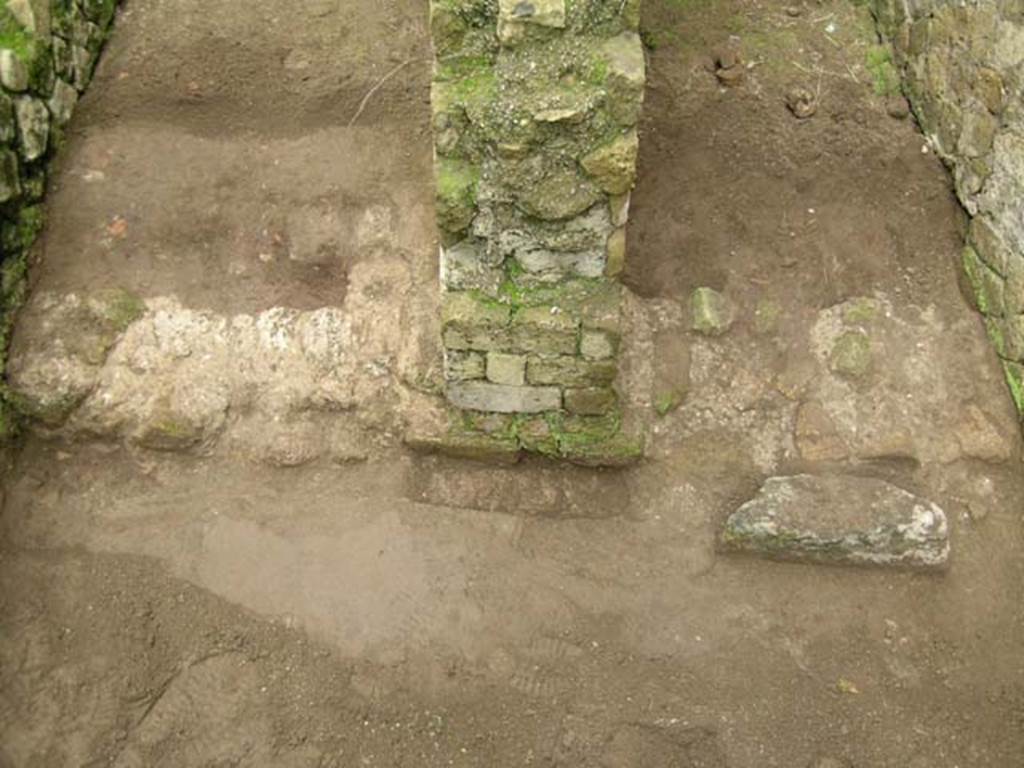 Ins. Orientalis II.7, Herculaneum. December 2004. Looking west towards details of areas of two thresholds.
Photo courtesy of Nicolas Monteix.